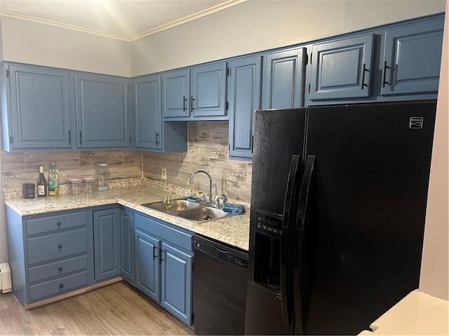 1097 Pontiac Ave, Cranston, RI 02910 - kitchen featuring black fridge, dishwasher, blue cabinets, a sink, and light countertops