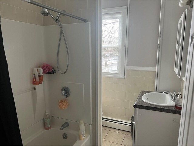 1097 Pontiac Ave, Cranston, RI 02910 - full bathroom featuring a baseboard heating unit, vanity, tile walls, shower / bath combination, and tile patterned flooring