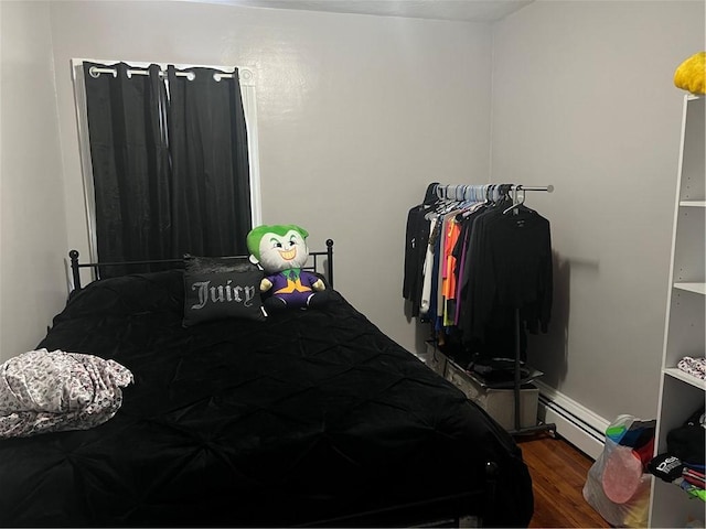 1097 Pontiac Ave, Cranston, RI 02910 - bedroom featuring wood finished floors and a baseboard heating unit