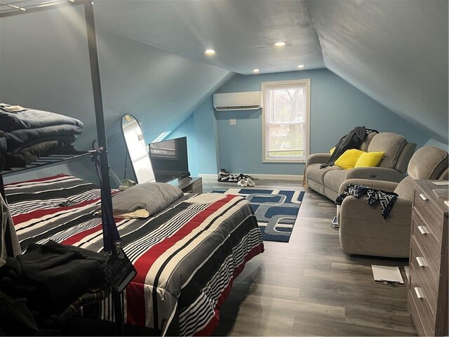 1097 Pontiac Ave, Cranston, RI 02910 - bedroom with a wall mounted air conditioner, wood finished floors, vaulted ceiling, baseboards, and recessed lighting