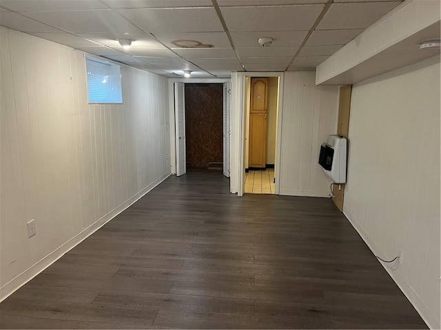 1097 Pontiac Ave, Cranston, RI 02910 - finished below grade area with heating unit, dark wood-style floors, a paneled ceiling, and baseboards