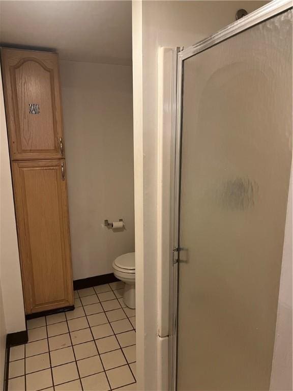 1097 Pontiac Ave, Cranston, RI 02910 - bathroom featuring a shower stall, tile patterned flooring, toilet, and baseboards