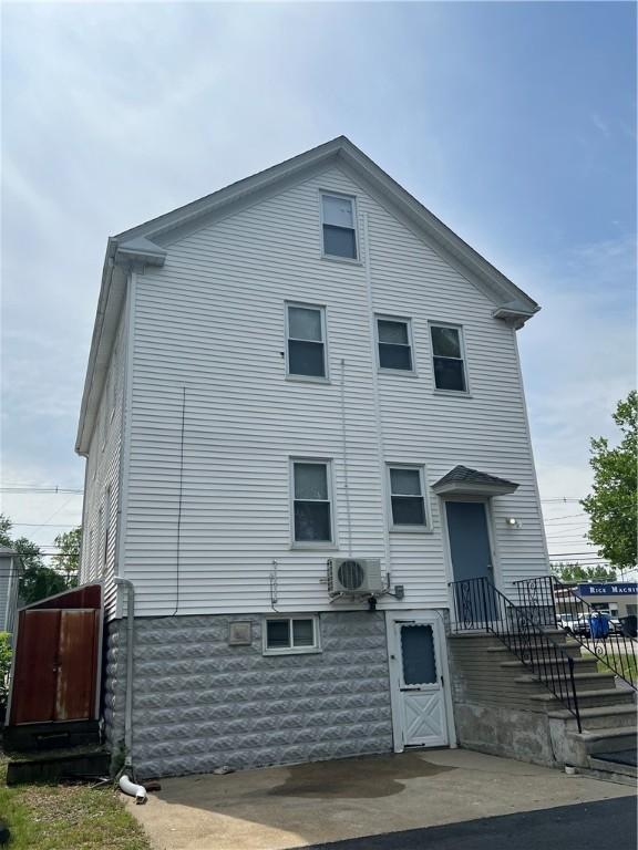 1097 Pontiac Ave, Cranston, RI 02910 - rear view of house with a cooling unit