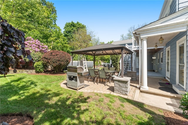 62 Andrews Ave, West Warwick, RI 02893 - view of green lawn with a gazebo, a patio, outdoor dining area, and stairway