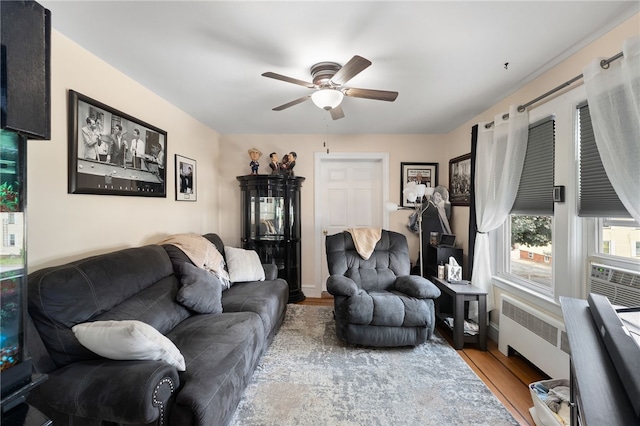 62 Andrews Ave, West Warwick, RI 02893 - living area with a ceiling fan, wood finished floors, and radiator