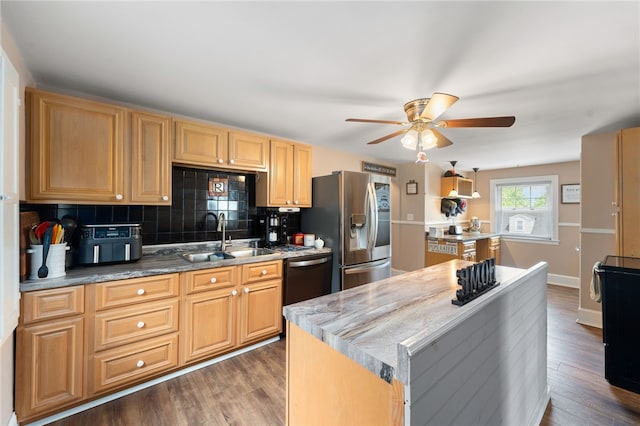 62 Andrews Ave, West Warwick, RI 02893 - kitchen featuring a sink, stainless steel appliances, a ceiling fan, a center island, and backsplash