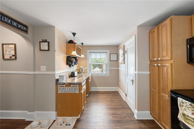 62 Andrews Ave, West Warwick, RI 02893 - kitchen featuring dark wood-style flooring, black electric range, arched walkways, baseboards, and hanging light fixtures