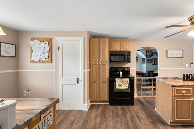 62 Andrews Ave, West Warwick, RI 02893 - kitchen with black appliances, ceiling fan, arched walkways, and dark wood-type flooring