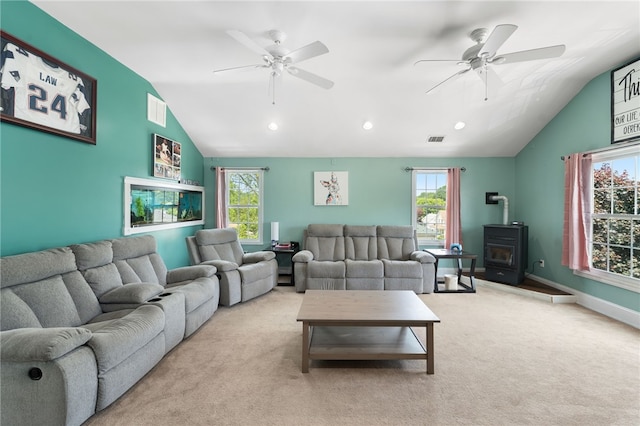 62 Andrews Ave, West Warwick, RI 02893 - living room with lofted ceiling, a wood stove, a ceiling fan, carpet flooring, and recessed lighting