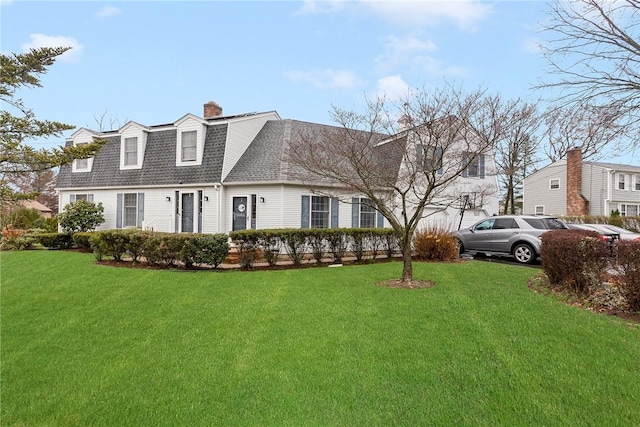 6 Lake Dr, North Providence, RI 02904 - colonial inspired home featuring a shingled roof, a front yard, and a chimney