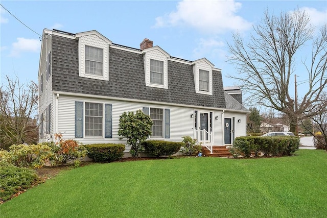 6 Lake Dr, North Providence, RI 02904 - colonial inspired home with roof with shingles, a chimney, and a front yard