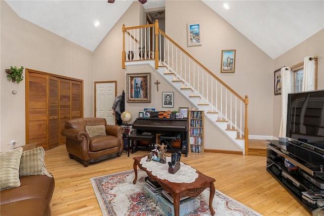 6 Lake Dr, North Providence, RI 02904 - living area featuring high vaulted ceiling, stairs, light wood finished floors, baseboards, and recessed lighting