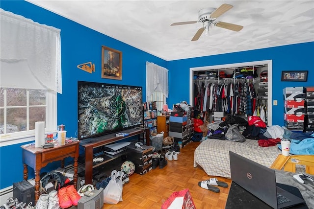6 Lake Dr, North Providence, RI 02904 - bedroom with a closet, a baseboard heating unit, and ceiling fan
