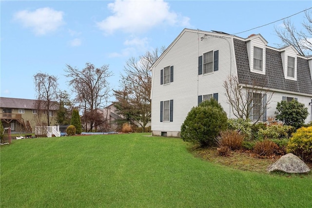 6 Lake Dr, North Providence, RI 02904 - view of property exterior featuring a yard, roof with shingles, and a gambrel roof