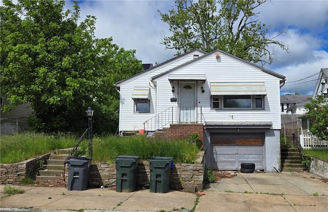 105 Pemberton St, Providence, RI 02908 - view of front of property featuring stairs, driveway, and a garage