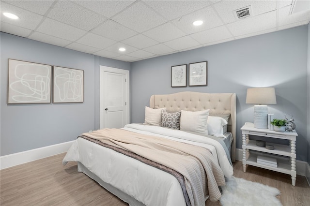 22 Halsey St Unit 1, Providence, RI 02906 - bedroom with baseboards, wood finished floors, recessed lighting, and a paneled ceiling