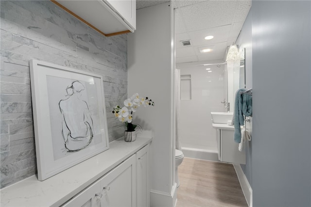 22 Halsey St Unit 1, Providence, RI 02906 - bathroom with vanity, toilet, a shower stall, baseboards, and wood finished floors