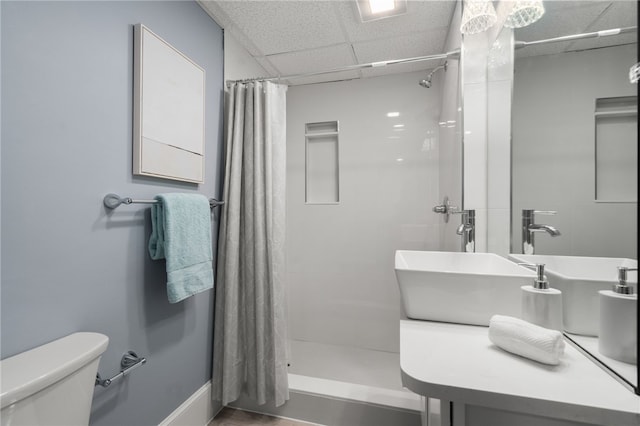 22 Halsey St Unit 1, Providence, RI 02906 - bathroom with toilet, a drop ceiling, tiled shower, and vanity