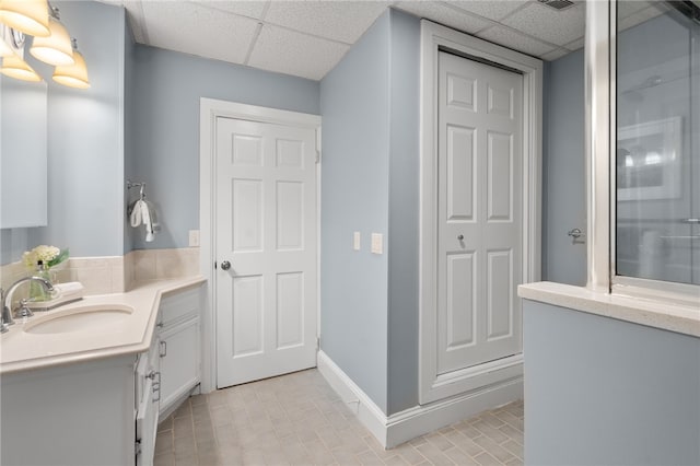22 Halsey St Unit 1, Providence, RI 02906 - bathroom with a paneled ceiling, vanity, baseboards, and an enclosed shower