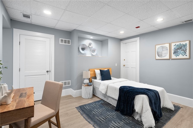 22 Halsey St Unit 1, Providence, RI 02906 - bedroom featuring light wood-style floors, recessed lighting, baseboards, a drop ceiling, and a closet