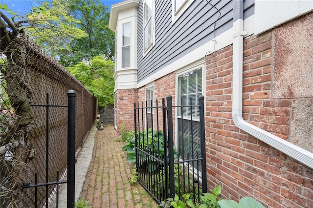 22 Halsey St Unit 1, Providence, RI 02906 - view of property exterior with brick siding and a gate