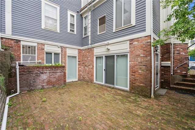 22 Halsey St Unit 1, Providence, RI 02906 - rear view of house with brick siding