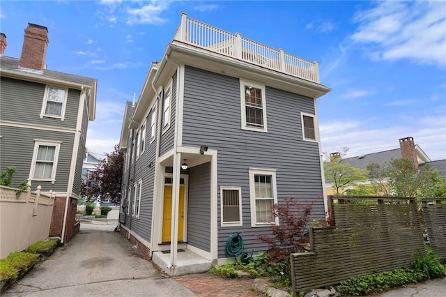 22 Halsey St Unit 1, Providence, RI 02906 - view of front facade with a balcony and asphalt driveway