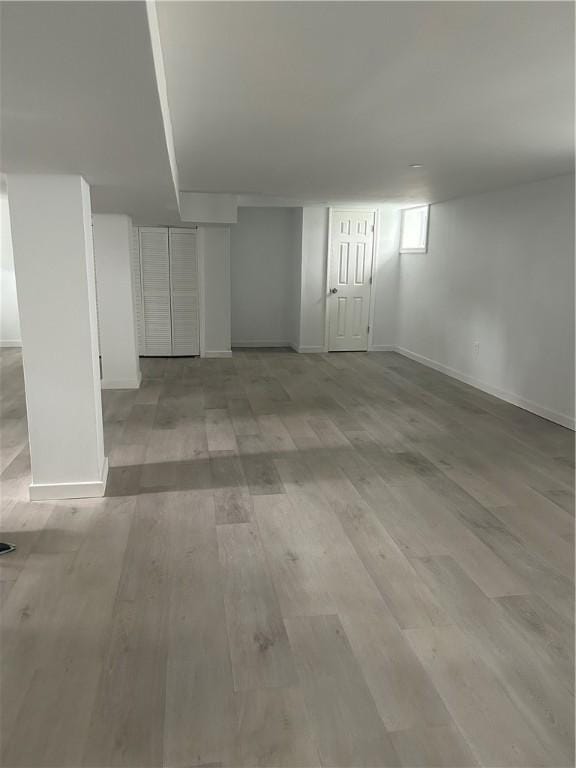 26 Mayflower St, East Providence, RI 02914 - finished basement featuring light wood-style flooring and baseboards