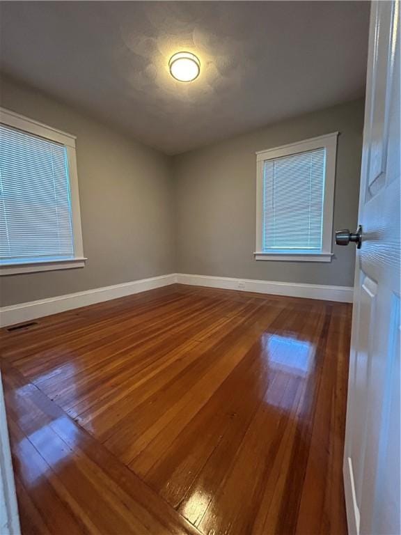 26 Mayflower St, East Providence, RI 02914 - empty room featuring hardwood / wood-style flooring and baseboards
