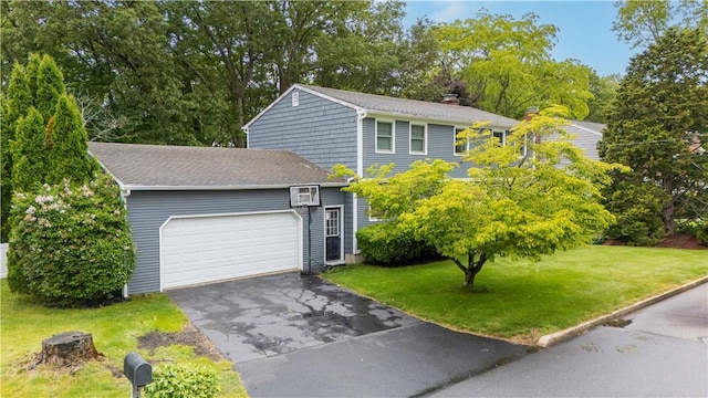 67 Hathaway Dr, West Warwick, RI 02893 - view of front facade featuring an attached garage, driveway, a front yard, and a chimney