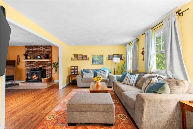 67 Hathaway Dr, West Warwick, RI 02893 - living area featuring wood finished floors and a fireplace