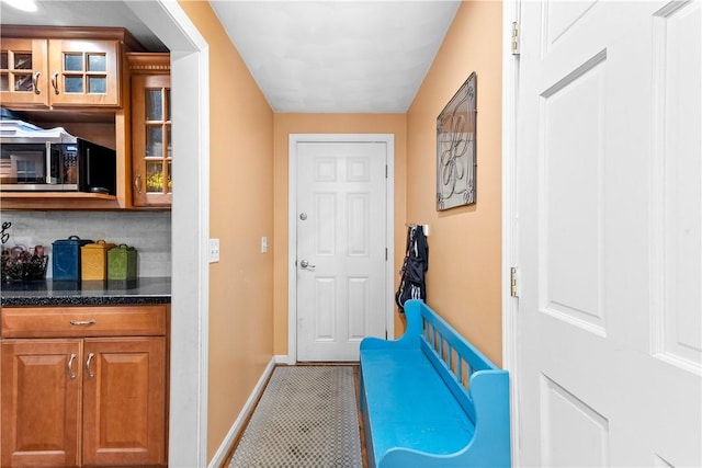 67 Hathaway Dr, West Warwick, RI 02893 - doorway featuring baseboards and tile patterned floors