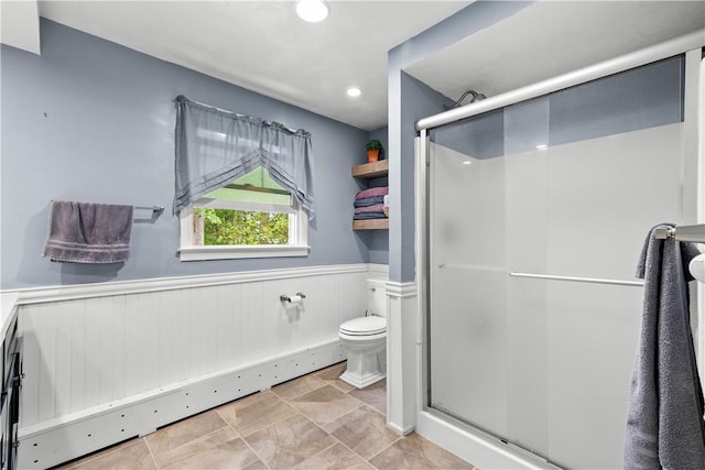 67 Hathaway Dr, West Warwick, RI 02893 - bathroom with wainscoting, a shower stall, toilet, and recessed lighting