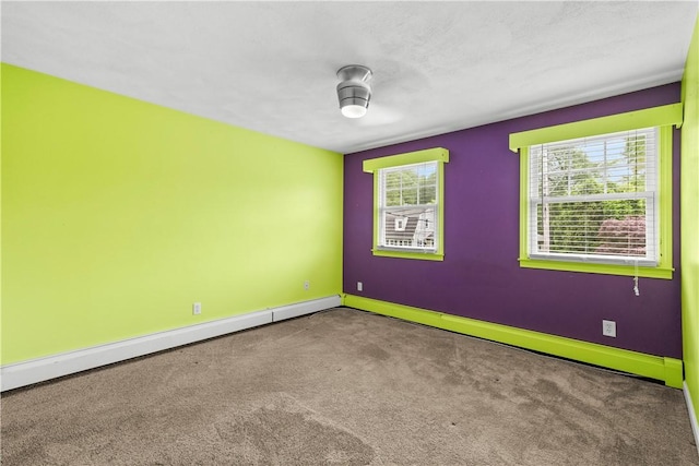 67 Hathaway Dr, West Warwick, RI 02893 - spare room featuring carpet, baseboards, and baseboard heating