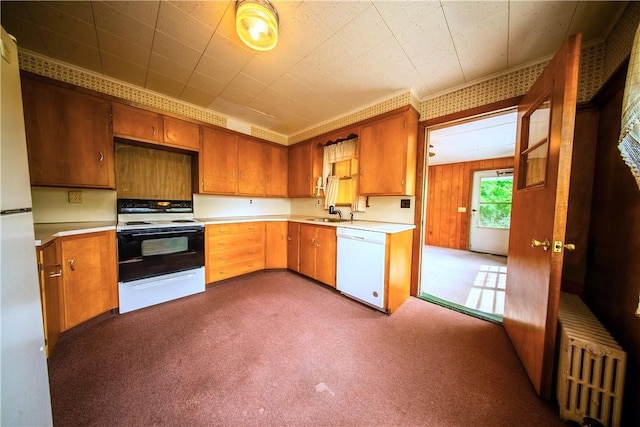 102 Buttonwoods Ave, Warwick, RI 02886 - kitchen with white appliances, light countertops, a sink, and dark colored carpet