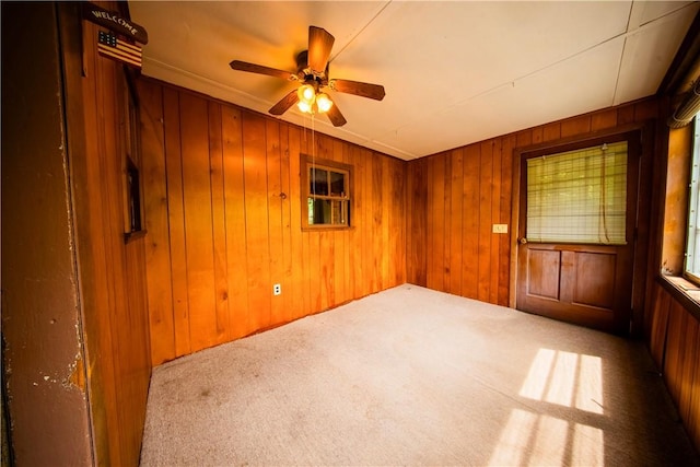 102 Buttonwoods Ave, Warwick, RI 02886 - unfurnished room with carpet floors, wooden walls, and a ceiling fan