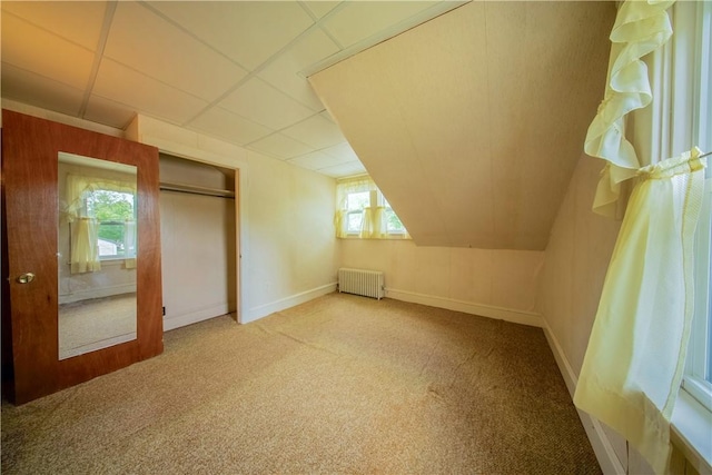 102 Buttonwoods Ave, Warwick, RI 02886 - additional living space with radiator heating unit, carpet flooring, and baseboards