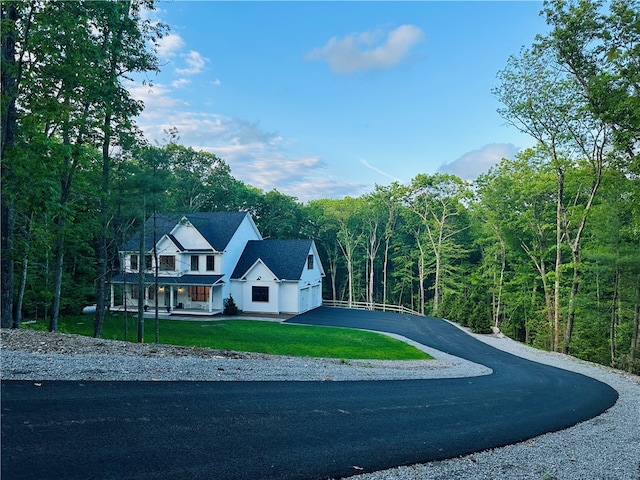 757 Cooper Rd, Glocester, RI 02814 - view of front of home featuring asphalt driveway, covered porch, a front lawn, a view of trees, and an attached garage