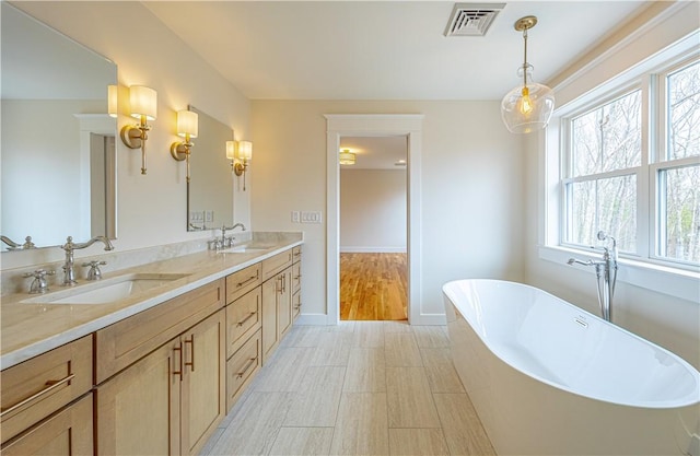 757 Cooper Rd, Glocester, RI 02814 - full bath featuring a freestanding bath, double vanity, and baseboards