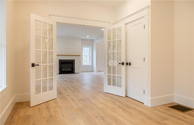 757 Cooper Rd, Glocester, RI 02814 - hall with french doors, wood finished floors, and baseboards