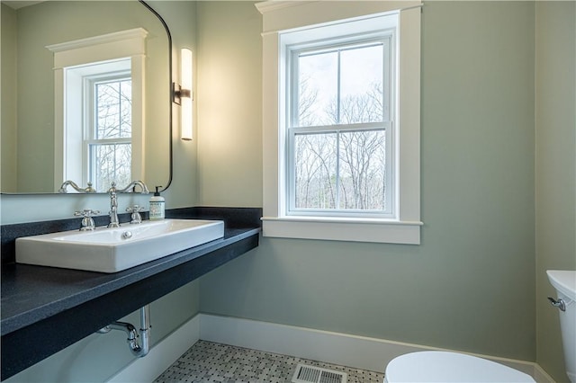 757 Cooper Rd, Glocester, RI 02814 - half bath with toilet, a sink, and baseboards