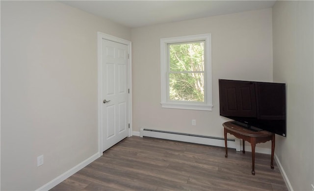 126 Hilton St, Tiverton, RI 02878 - living area featuring a baseboard radiator, wood finished floors, and baseboards