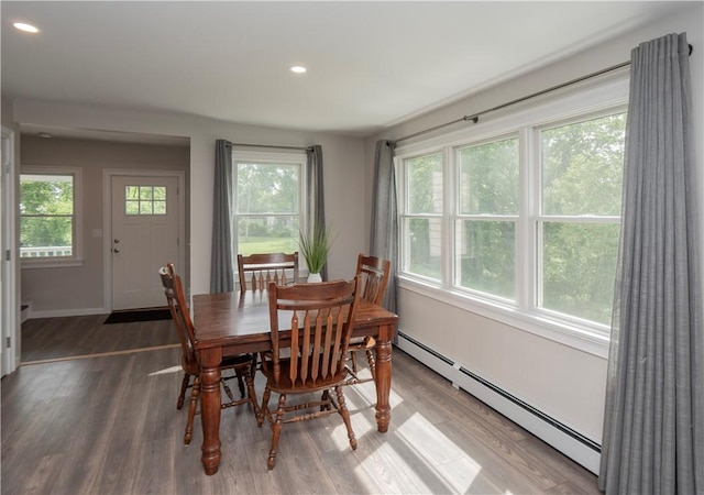 126 Hilton St, Tiverton, RI 02878 - dining space with a baseboard heating unit, wood finished floors, recessed lighting, and baseboards