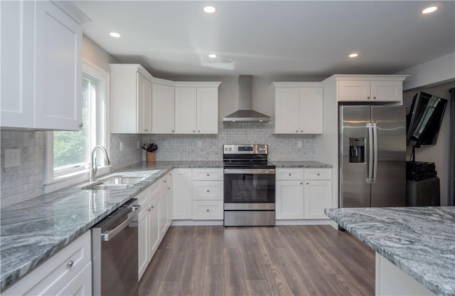 126 Hilton St, Tiverton, RI 02878 - kitchen with wall chimney range hood, appliances with stainless steel finishes, a sink, white cabinetry, and recessed lighting
