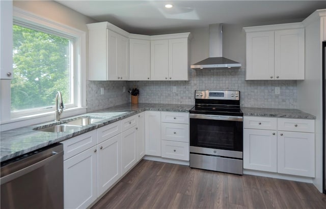 126 Hilton St, Tiverton, RI 02878 - kitchen featuring wall chimney range hood, appliances with stainless steel finishes, a sink, white cabinets, and backsplash