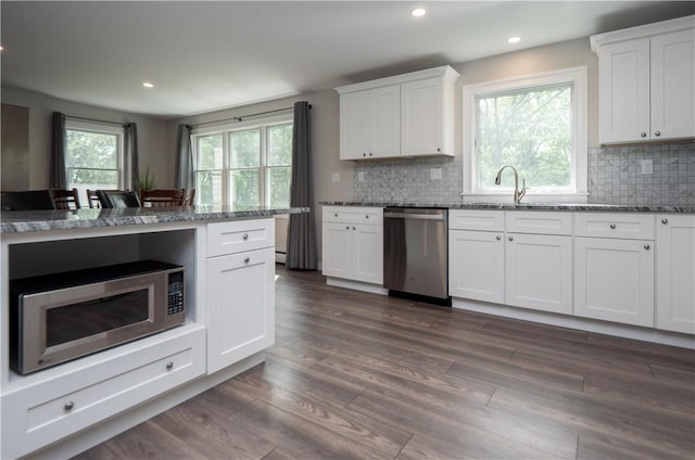 126 Hilton St, Tiverton, RI 02878 - kitchen featuring appliances with stainless steel finishes, stone counters, dark wood-style floors, backsplash, and recessed lighting