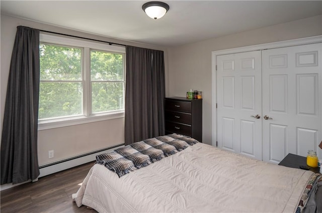 126 Hilton St, Tiverton, RI 02878 - bedroom with a baseboard heating unit, dark wood-style floors, and a closet