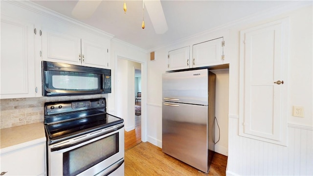 15 Franconia Dr, Cranston, RI 02920 - kitchen featuring stainless steel appliances, white cabinetry, light wood finished floors, and crown molding