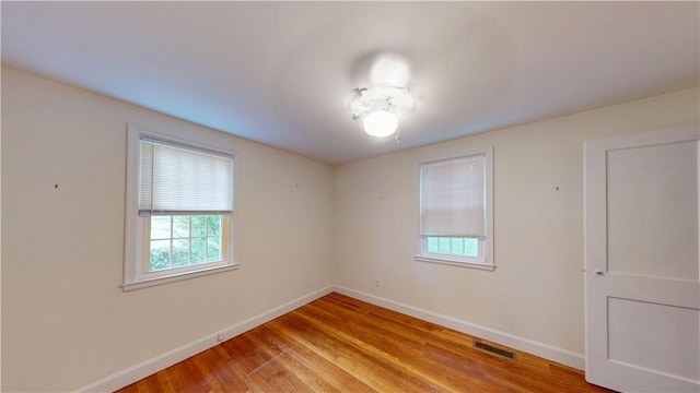 15 Franconia Dr, Cranston, RI 02920 - unfurnished room featuring plenty of natural light, baseboards, and light wood finished floors