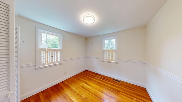 15 Franconia Dr, Cranston, RI 02920 - unfurnished bedroom with light wood-type flooring, multiple windows, and baseboards